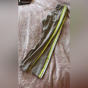 Lorna Jane size small.Olive Jogger Pants with Neon Yellow & White Stripes